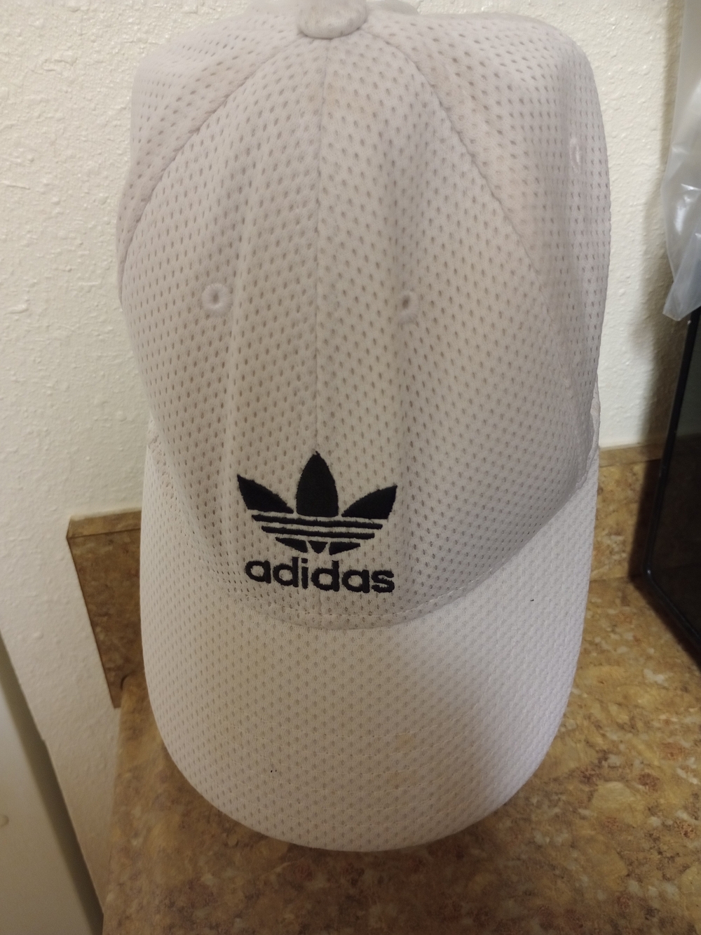 White Adidas Originals baseball cap featuring